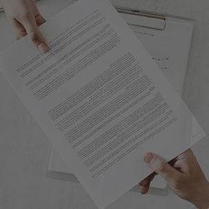 Someone handing paperwork to someone else